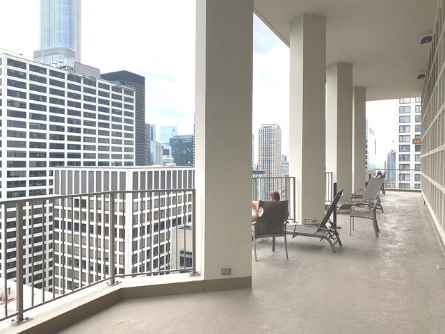 a view of a balcony with chairs