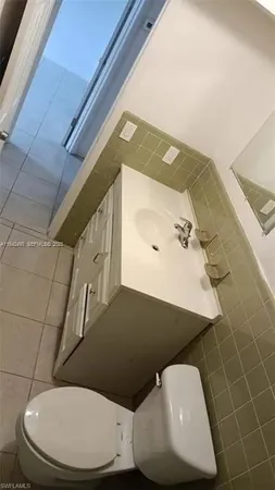 a toilet sitting next to a bathroom sink