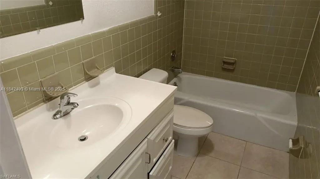2524 Congress Street, Unit 4 Fort Myers, FL 33901 - Photo 16 of 24 a bathroom with a sink a toilet and bathtub