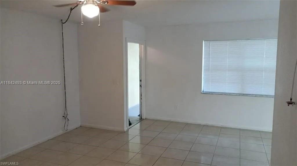 2524 Congress Street, Unit 4 Fort Myers, FL 33901 - Photo 2 of 24 an empty room with a fan