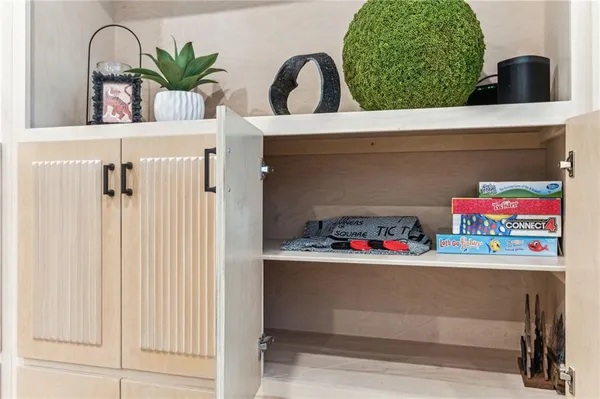 a view of a dinning table and chairs on deck with wooden floor