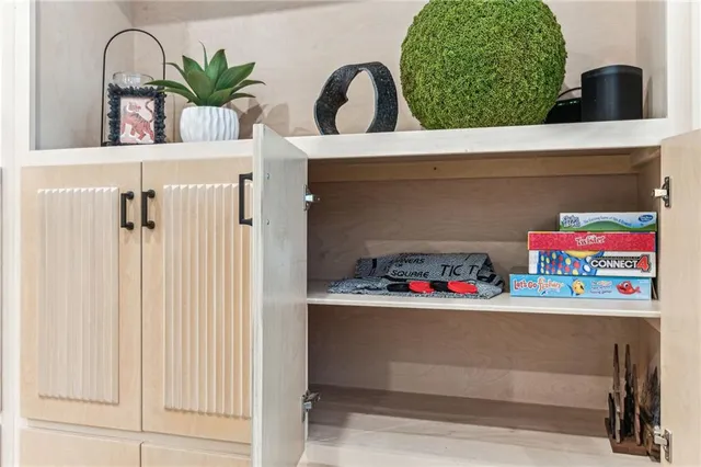 a view of a dinning table and chairs on deck with wooden floor