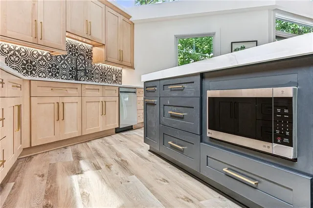 a bathroom with a toilet sink and a mirror