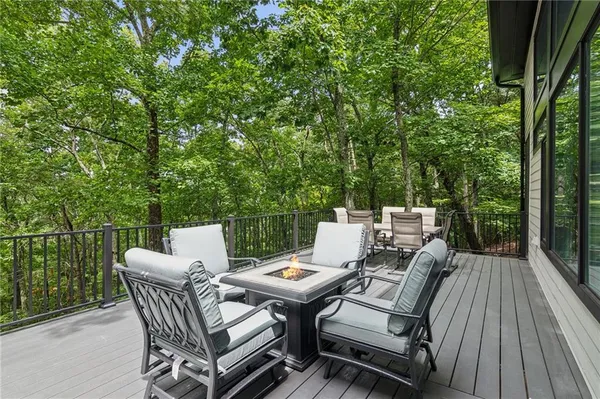 a spacious bedroom with a bed a couch and a window