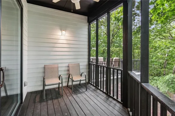 a view of a workspace with furniture and wooden floor
