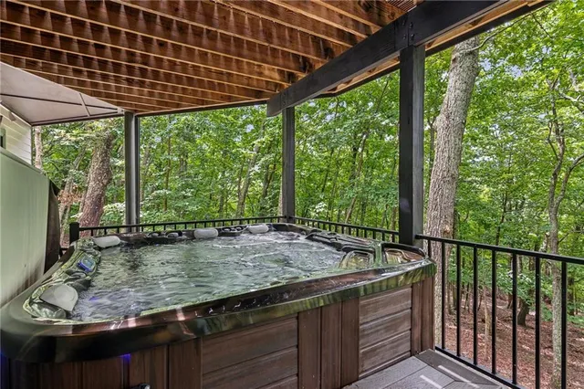 a view of backyard with wooden fence and a bench