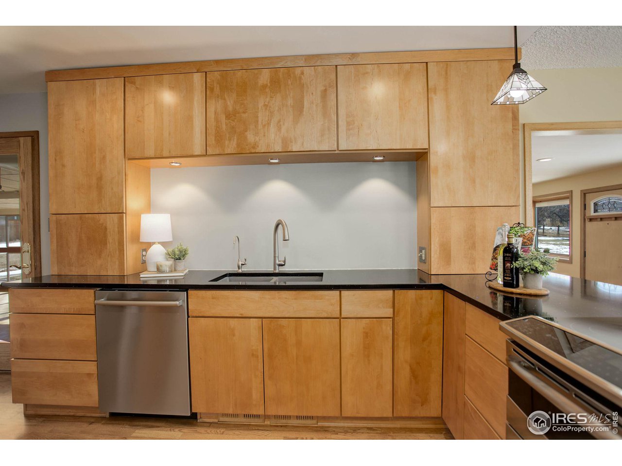 7714 Baseline Road Boulder, CO 80303 - Photo 12 of 38 a kitchen with a sink and cabinets