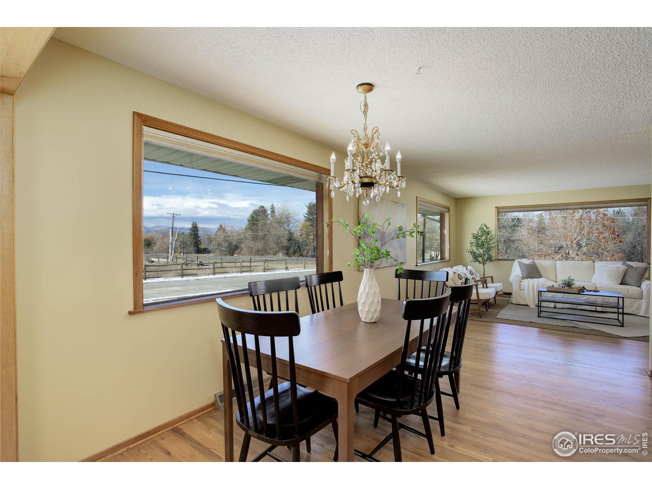 7714 Baseline Road Boulder, CO 80303 - Photo 17 of 38 a view of a dining room with furniture window and wooden floor