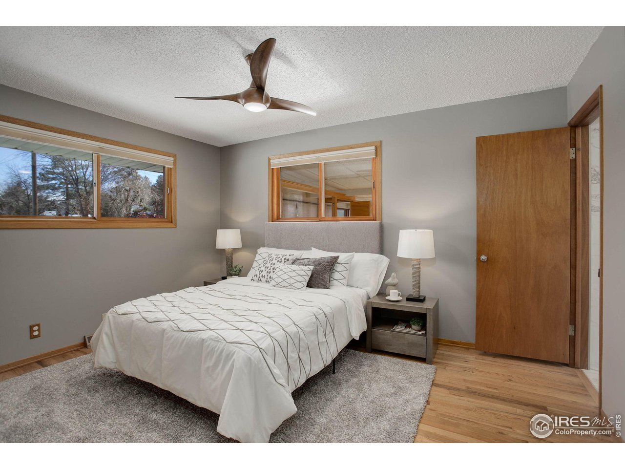 7714 Baseline Road Boulder, CO 80303 - Photo 24 of 38 a bedroom with a bed and window
