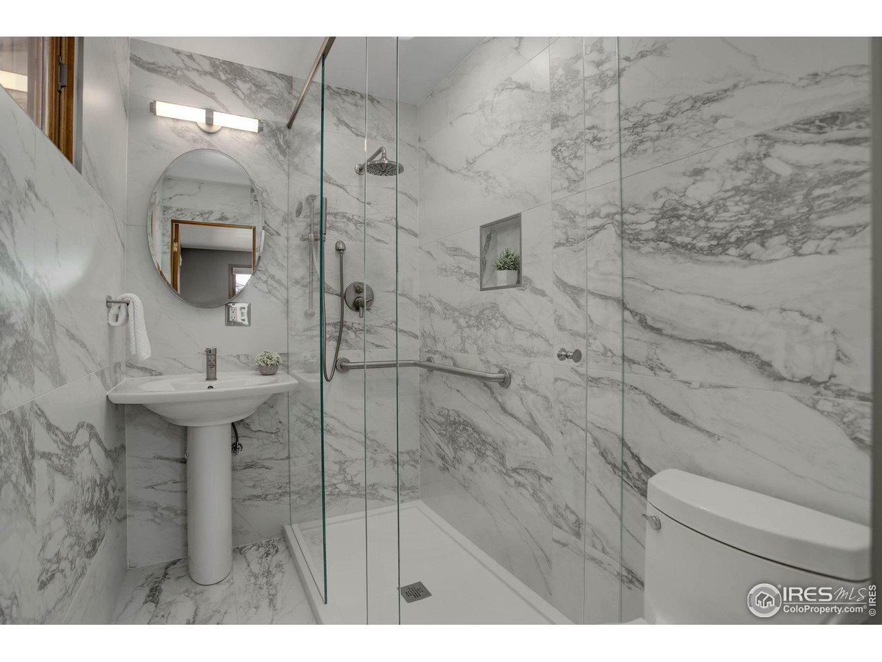 7714 Baseline Road Boulder, CO 80303 - Photo 25 of 38 a bathroom with a sink toilet and shower