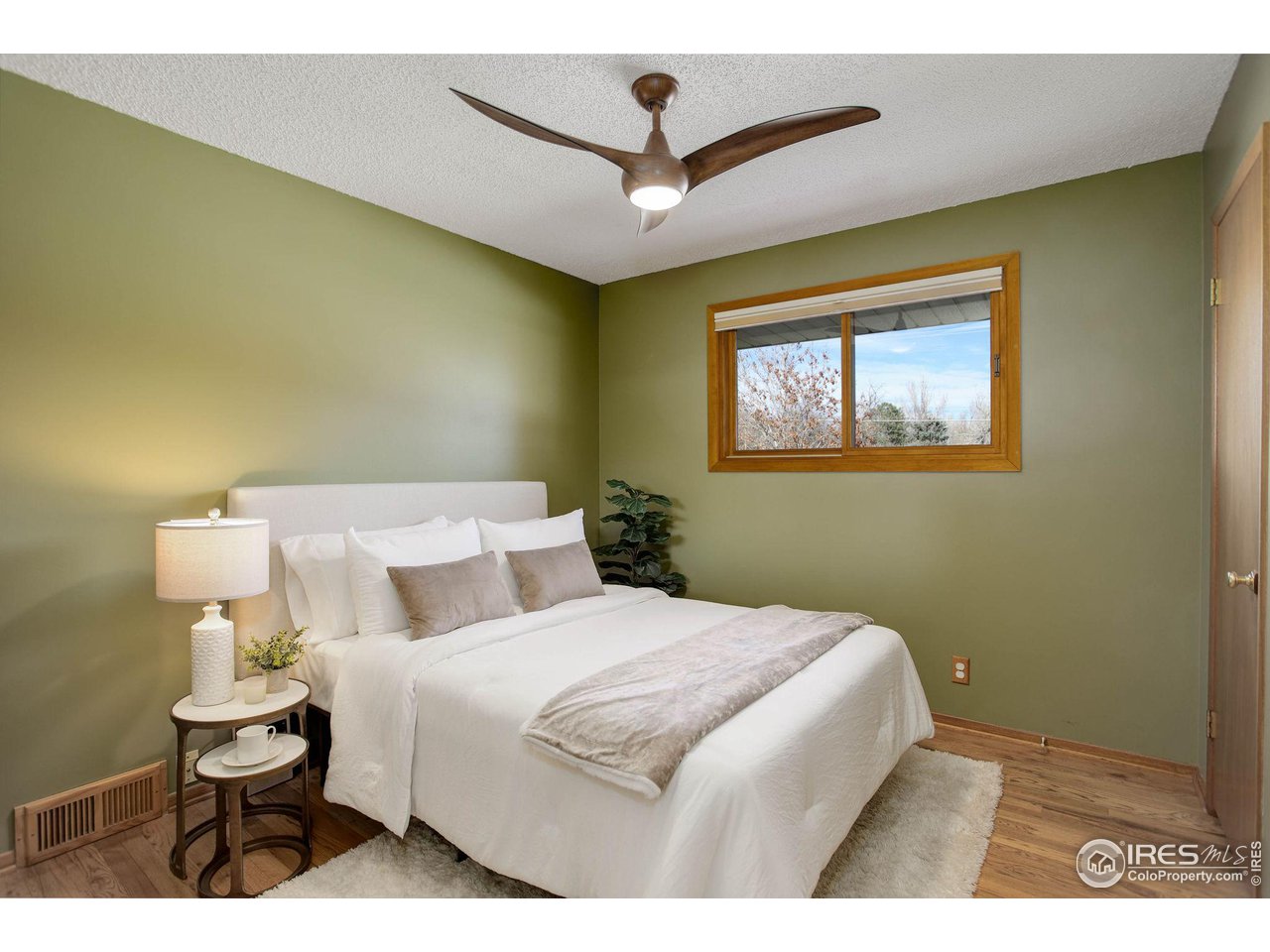 7714 Baseline Road Boulder, CO 80303 - Photo 26 of 38 a bedroom with a bed and a painting on the wall