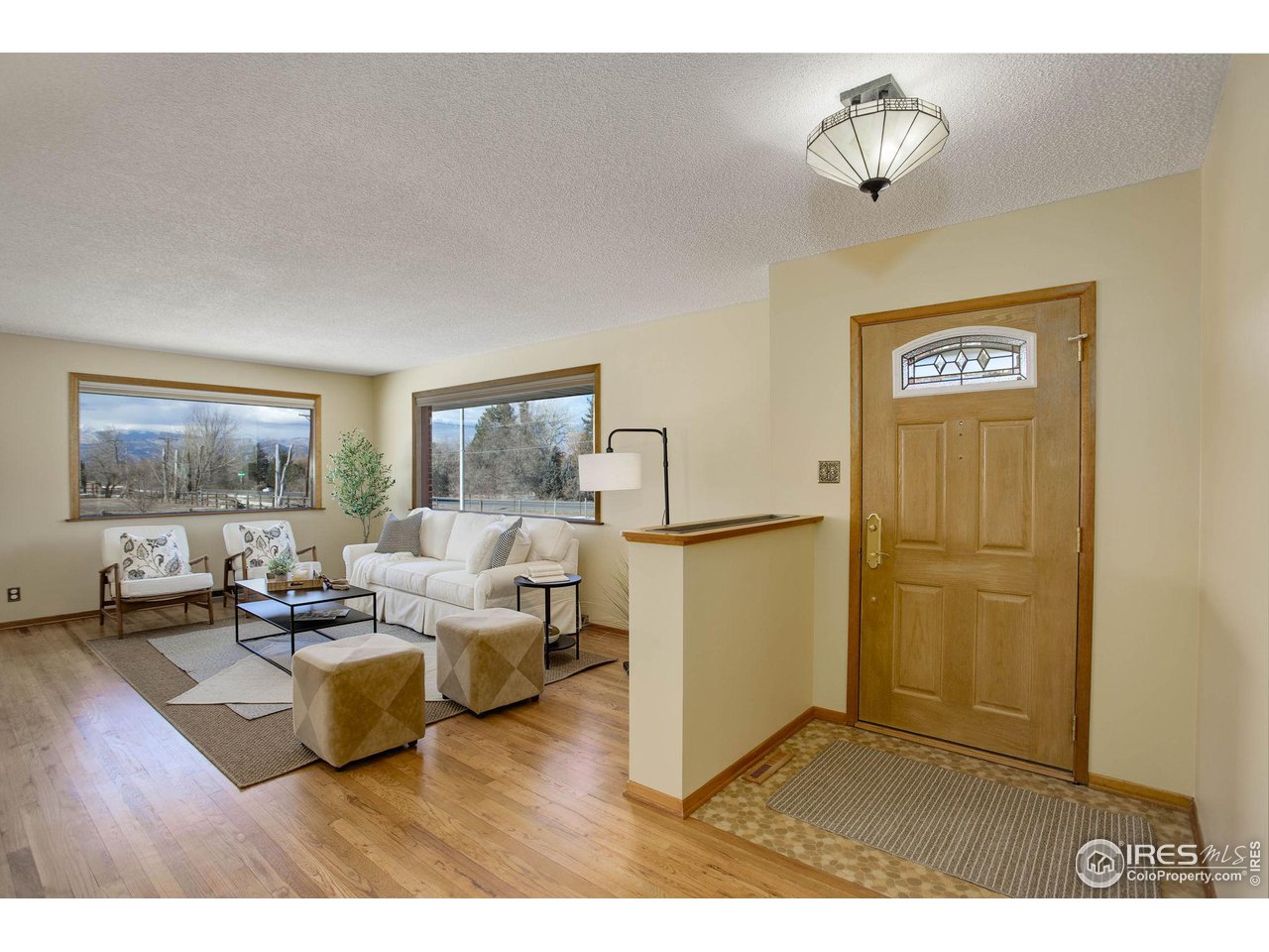 7714 Baseline Road Boulder, CO 80303 - Photo 5 of 38 a living room with furniture and a flat screen tv