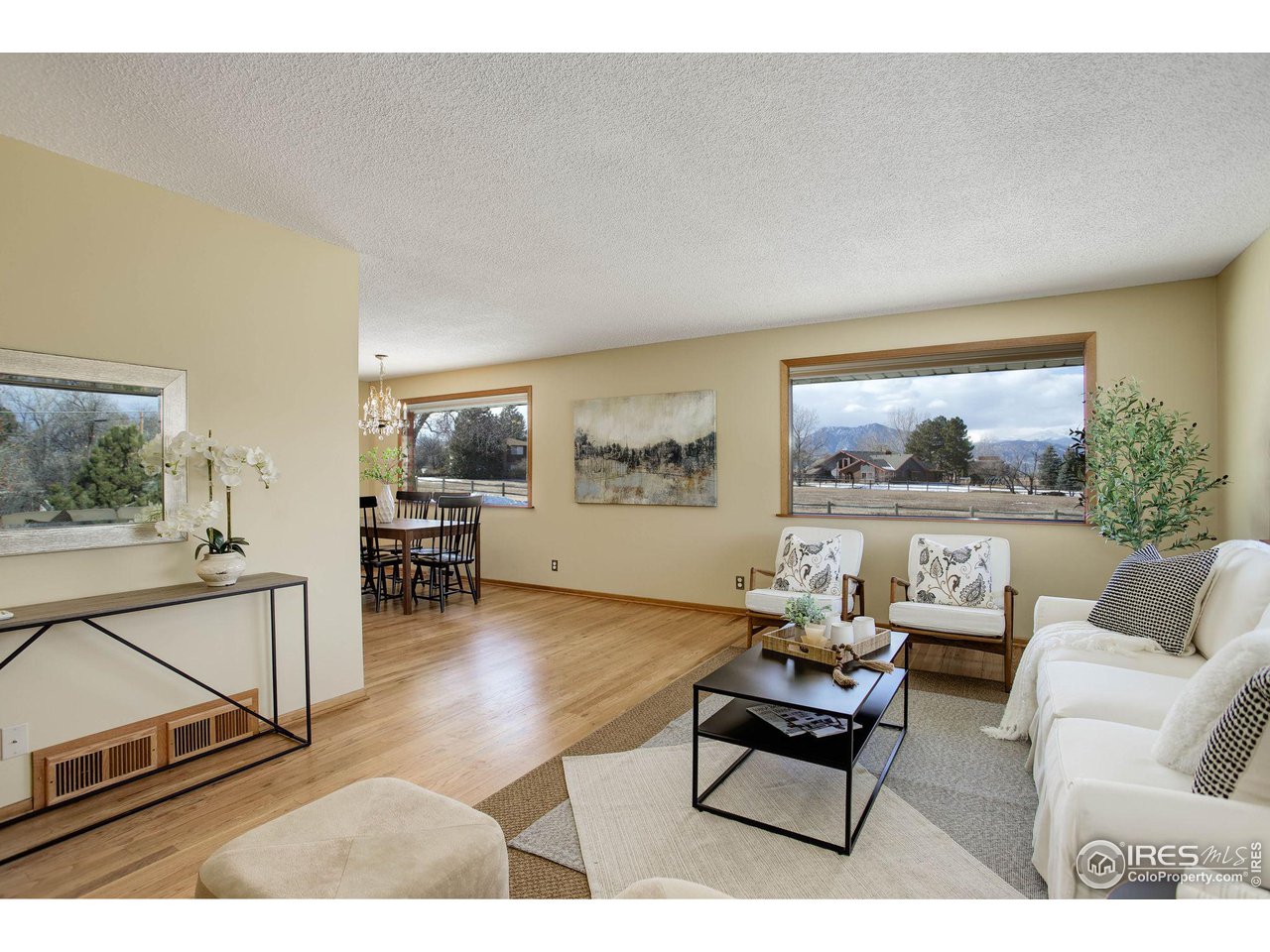 7714 Baseline Road Boulder, CO 80303 - Photo 7 of 38 a living room with furniture and a floor to ceiling window