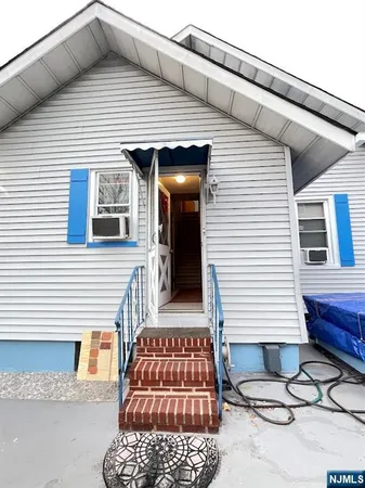 a front view of a house with garage