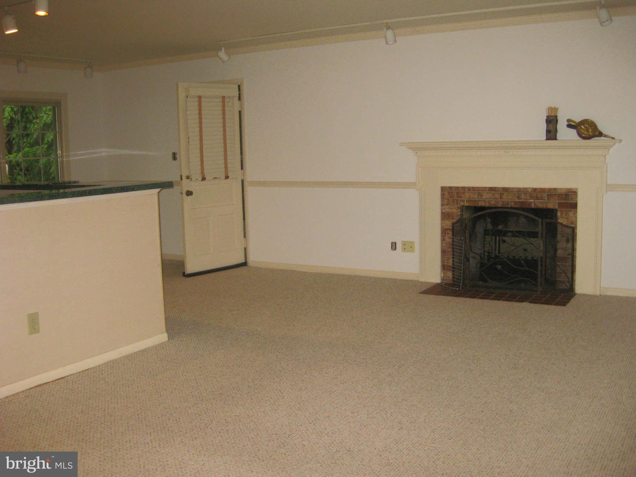 6405 Meriwether Lane Springfield, VA 22150 - Photo 2 of 14 a view of empty room with a fireplace