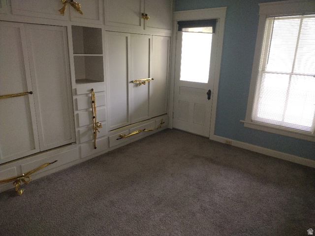 157 West 500 South Logan, UT 84321 - Photo 2 of 38 Built-in cabinetry with decorative gold-tone hardware, providing storage solutions