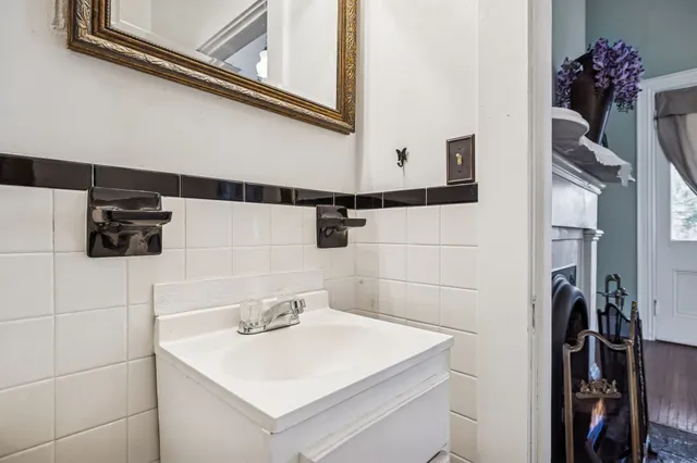 a view of a house with a tree and a street
