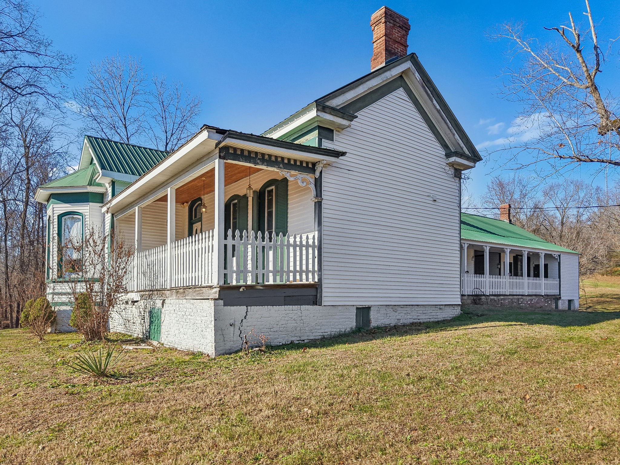 375 Highway 13 Waverly, TN 37185 - Photo 49 of 78 a front view of a house with a yard