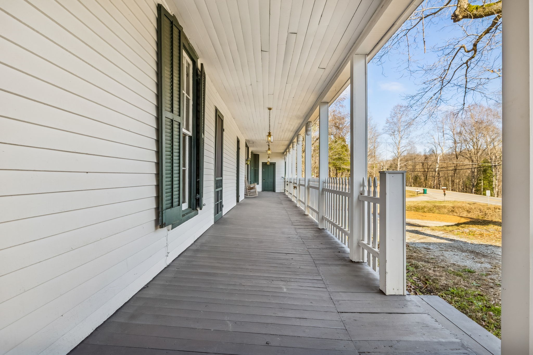 375 Highway 13 Waverly, TN 37185 - Photo 50 of 78 a view of a porch with wooden floor and stairs
