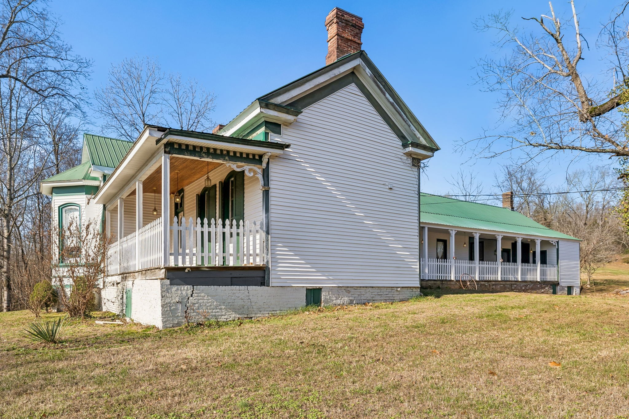 375 Highway 13 Waverly, TN 37185 - Photo 51 of 78 a view of a house with large windows and a small yard
