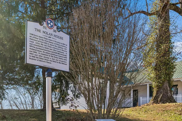 a kitchen with a stove and a refrigerator
