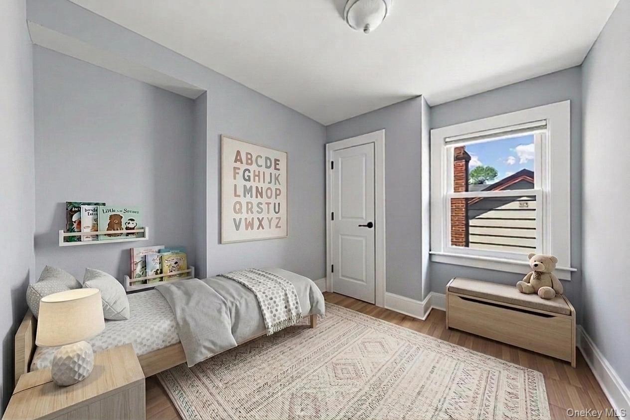 29-10 Butler Street Queens, NY 11369 - Photo 15 of 41 2nd floor middle bedroom staged