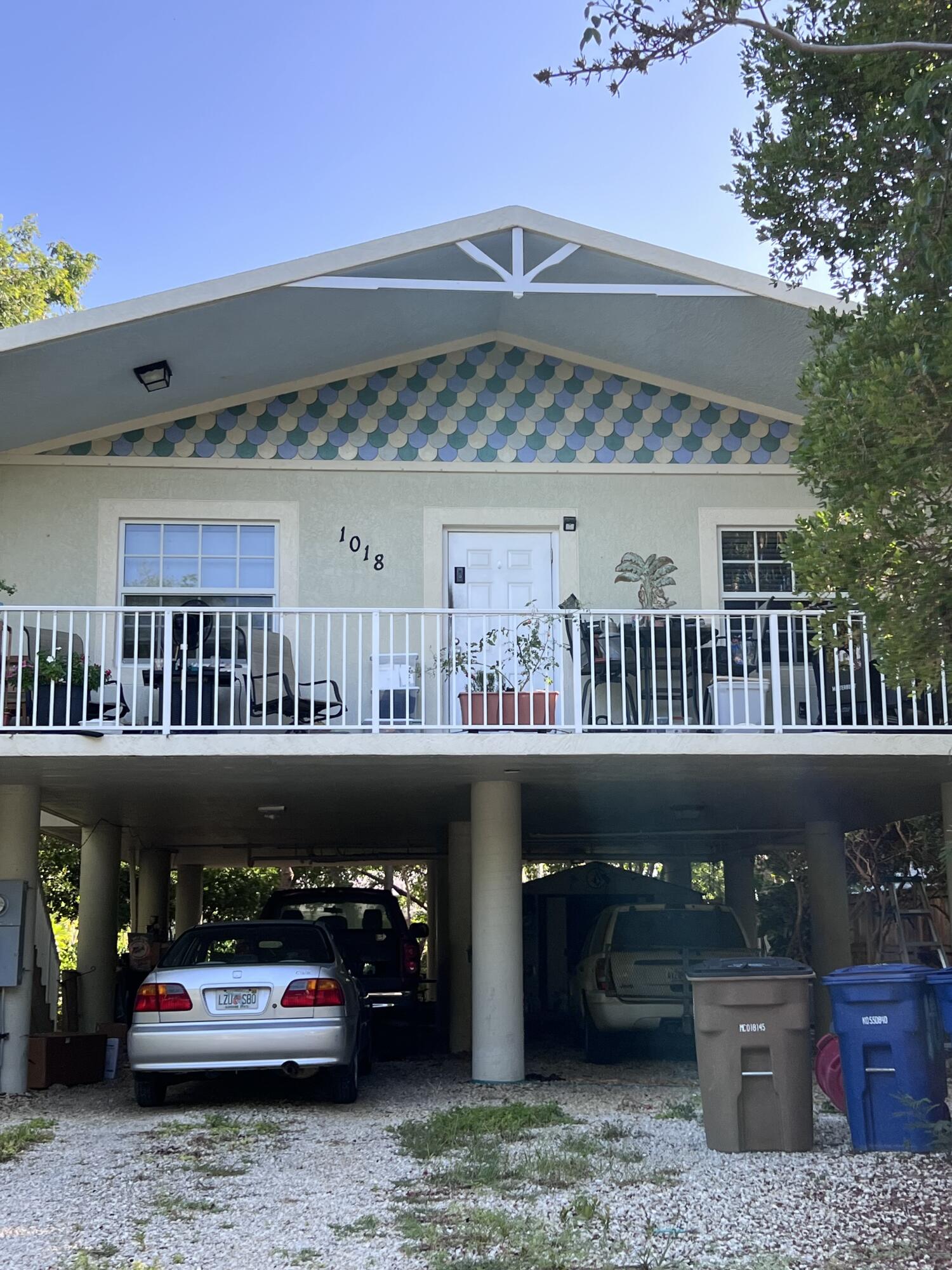 a front view of a house with roof deck