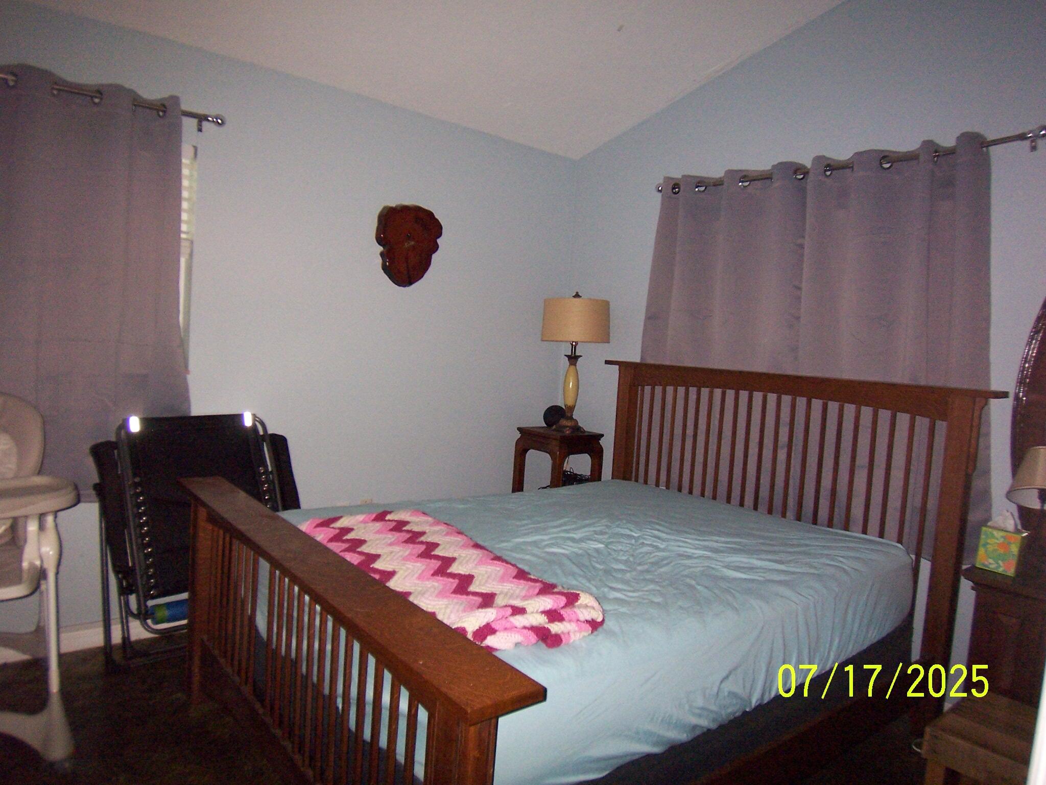 Undisclosed Address Key Largo, FL 33037 - Photo 13 of 19 a bedroom with a bed and a window