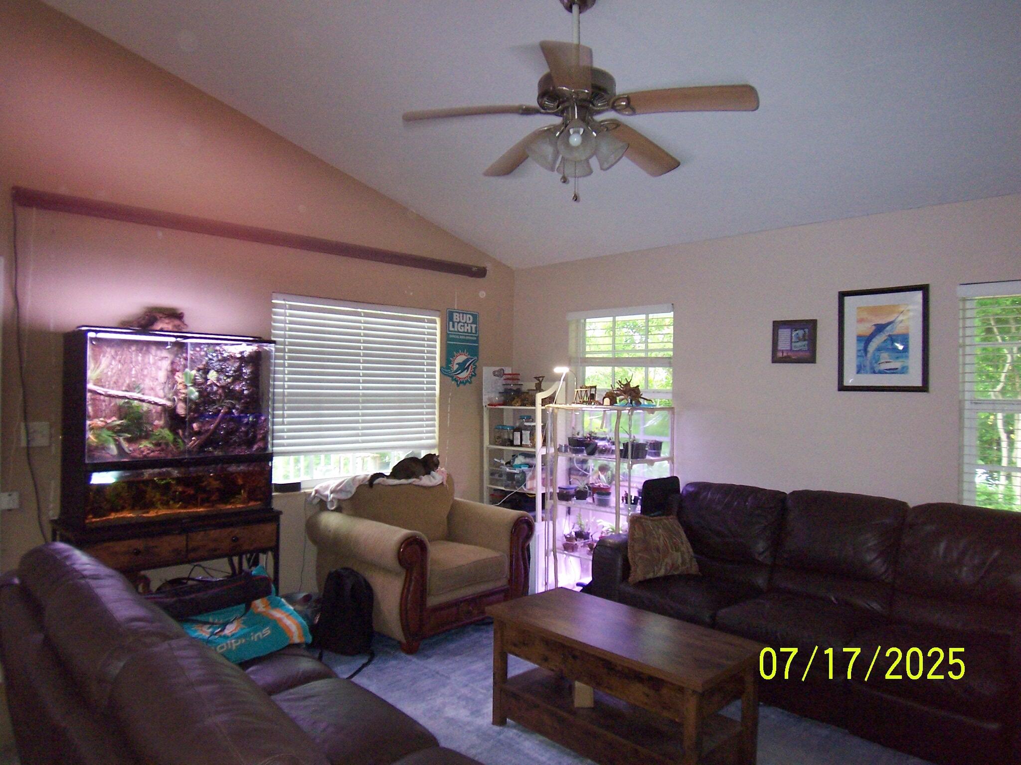 Undisclosed Address Key Largo, FL 33037 - Photo 3 of 19 a living room with furniture and a flat screen tv
