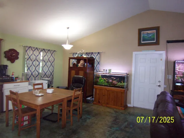 a view of a dining room with furniture