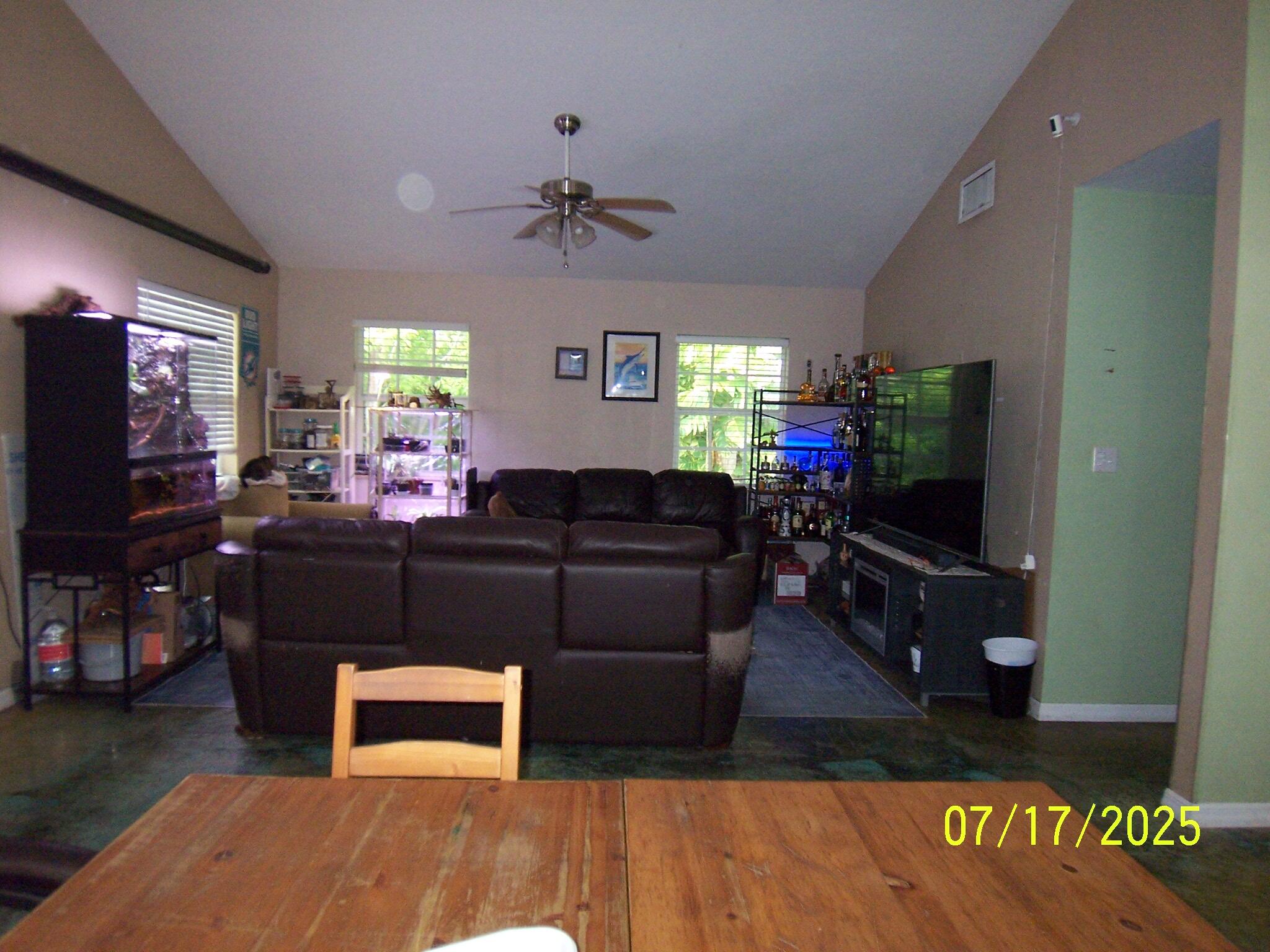Undisclosed Address Key Largo, FL 33037 - Photo 7 of 19 a living room with furniture and a flat screen tv