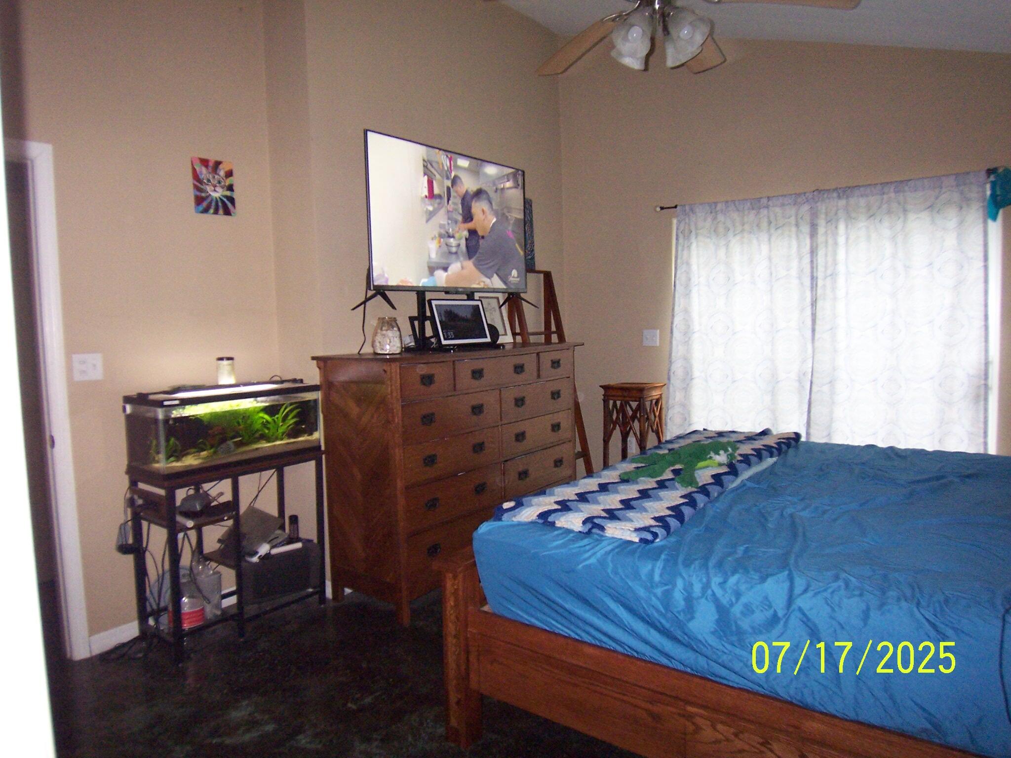 Undisclosed Address Key Largo, FL 33037 - Photo 10 of 19 a bedroom with a bed table and a window