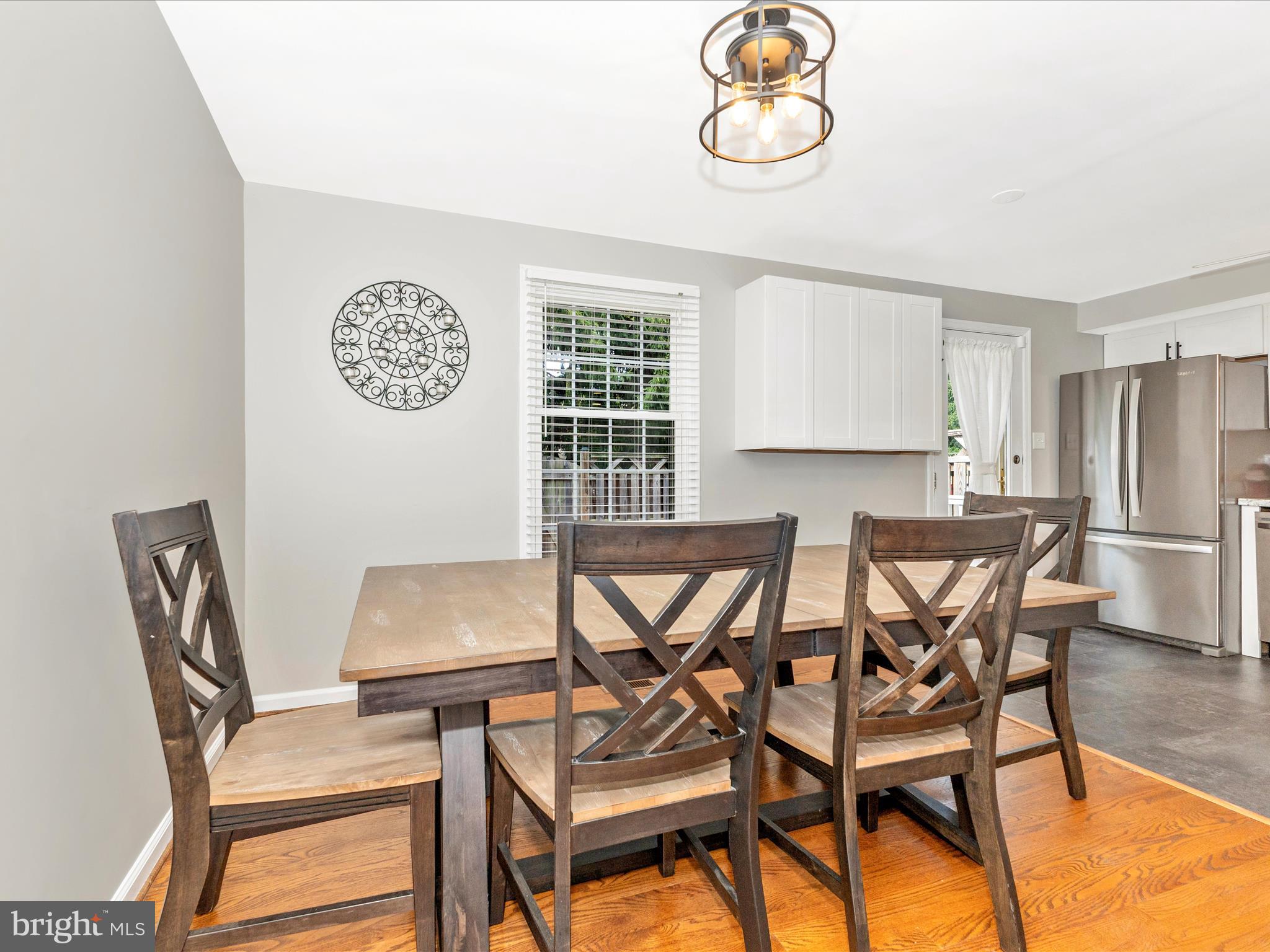8204 Red Wing Court Frederick, MD 21701 - Photo 12 of 72 a view of a dining room with furniture and a window