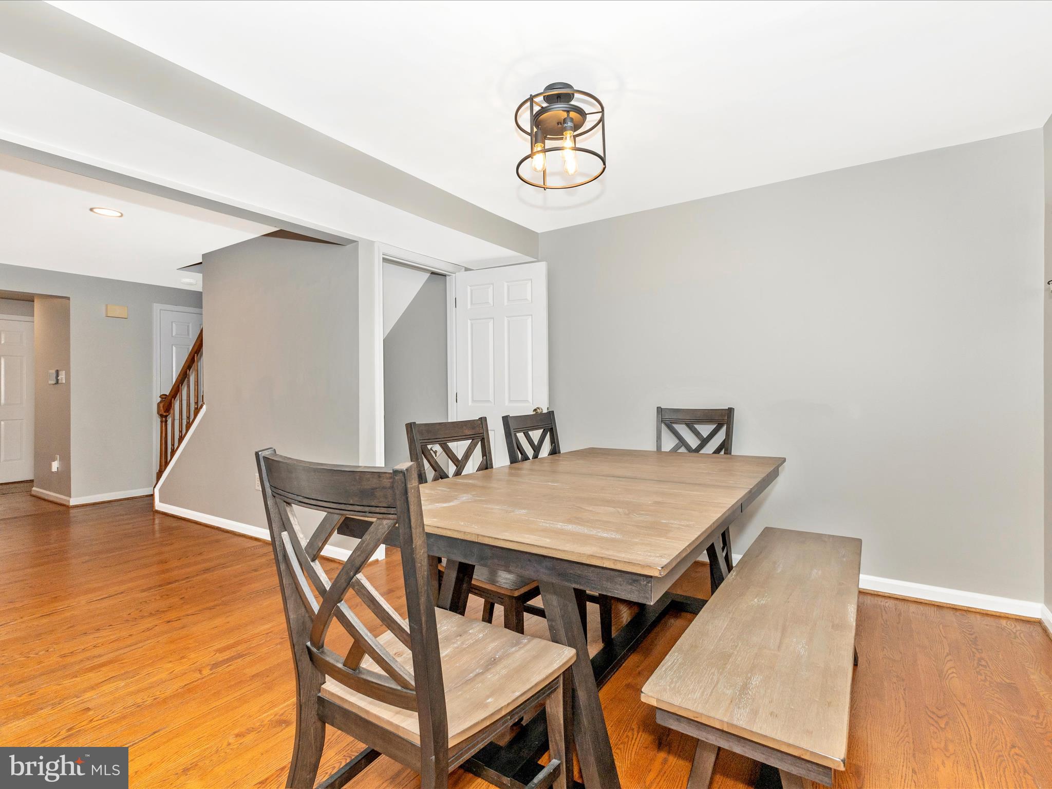 8204 Red Wing Court Frederick, MD 21701 - Photo 13 of 72 a view of a dining room with furniture and wooden floor