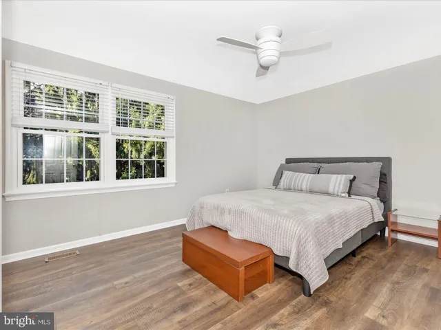an empty room with wooden floor