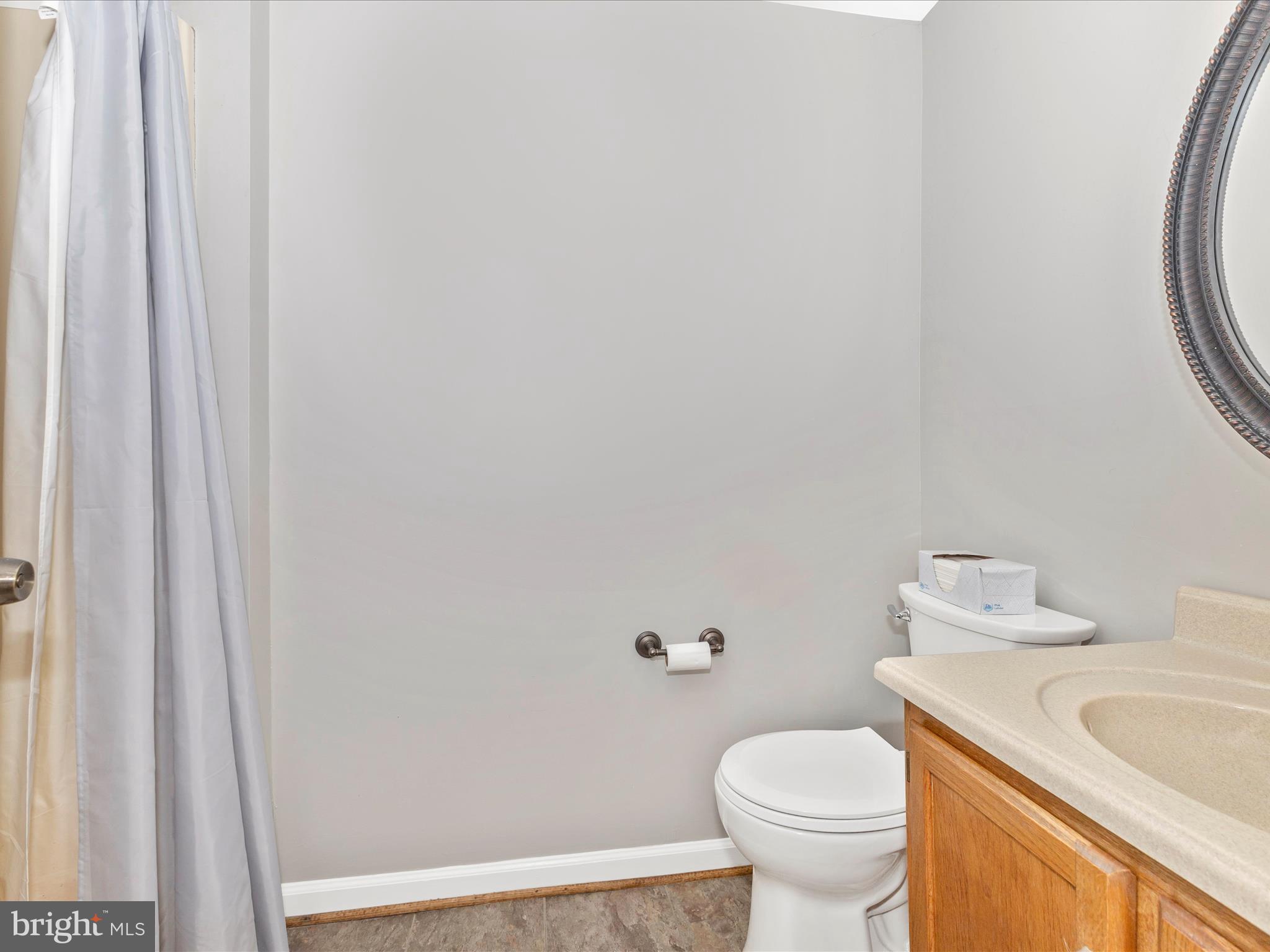 8204 Red Wing Court Frederick, MD 21701 - Photo 21 of 72 a white toilet sitting next to a bathroom sink