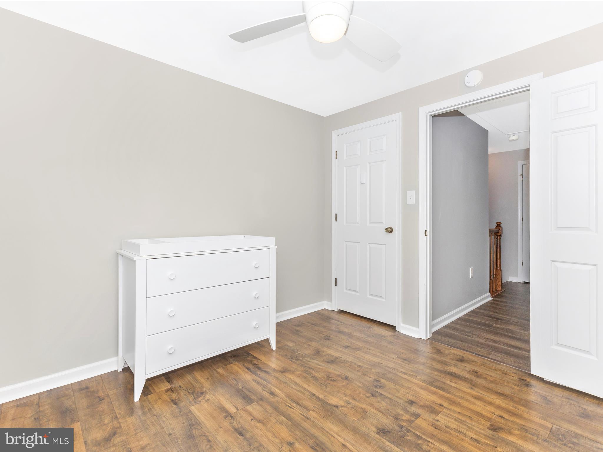 8204 Red Wing Court Frederick, MD 21701 - Photo 25 of 72 an empty room with wooden floor