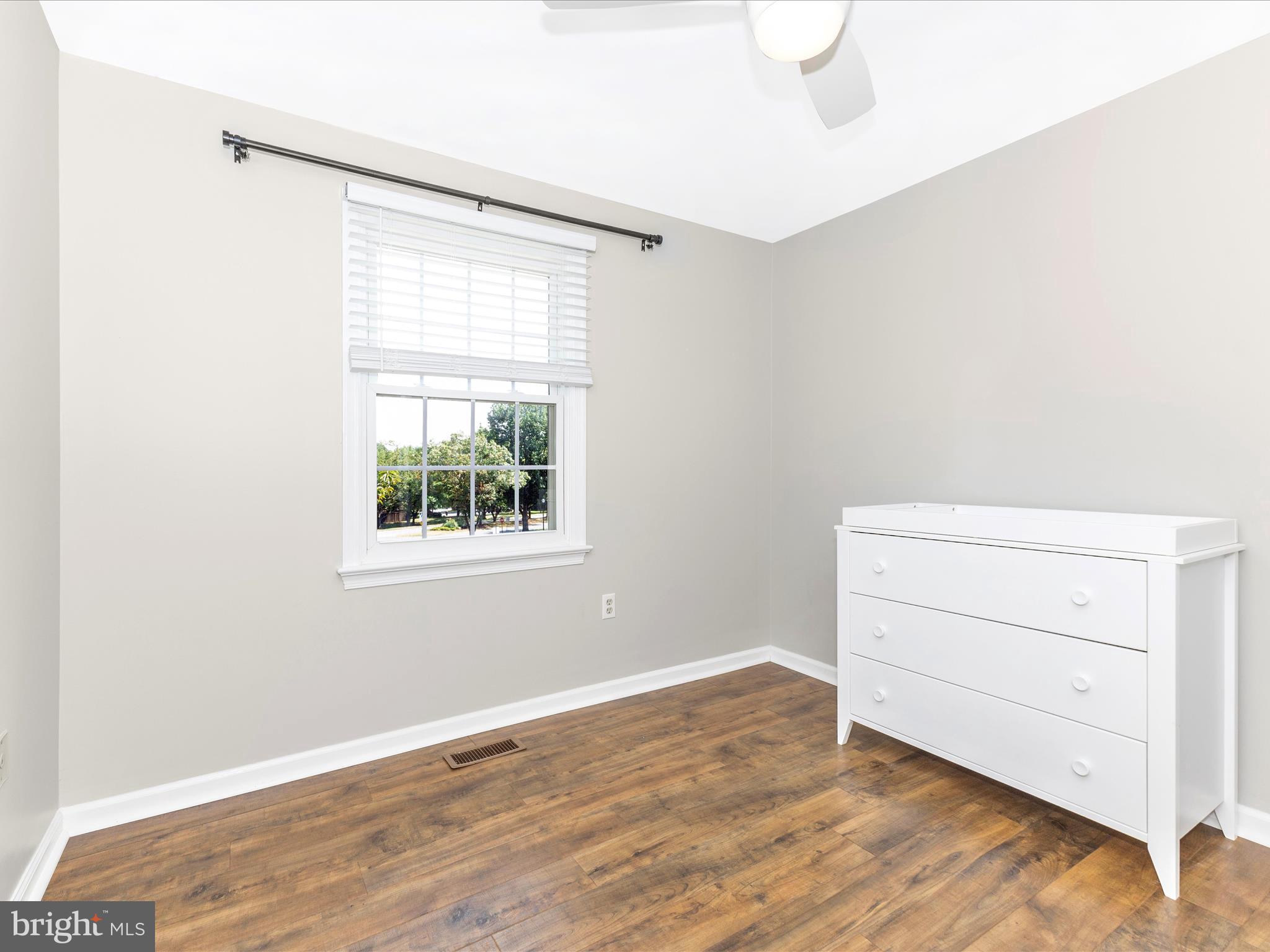 8204 Red Wing Court Frederick, MD 21701 - Photo 26 of 72 a view of a room with wooden floor and window