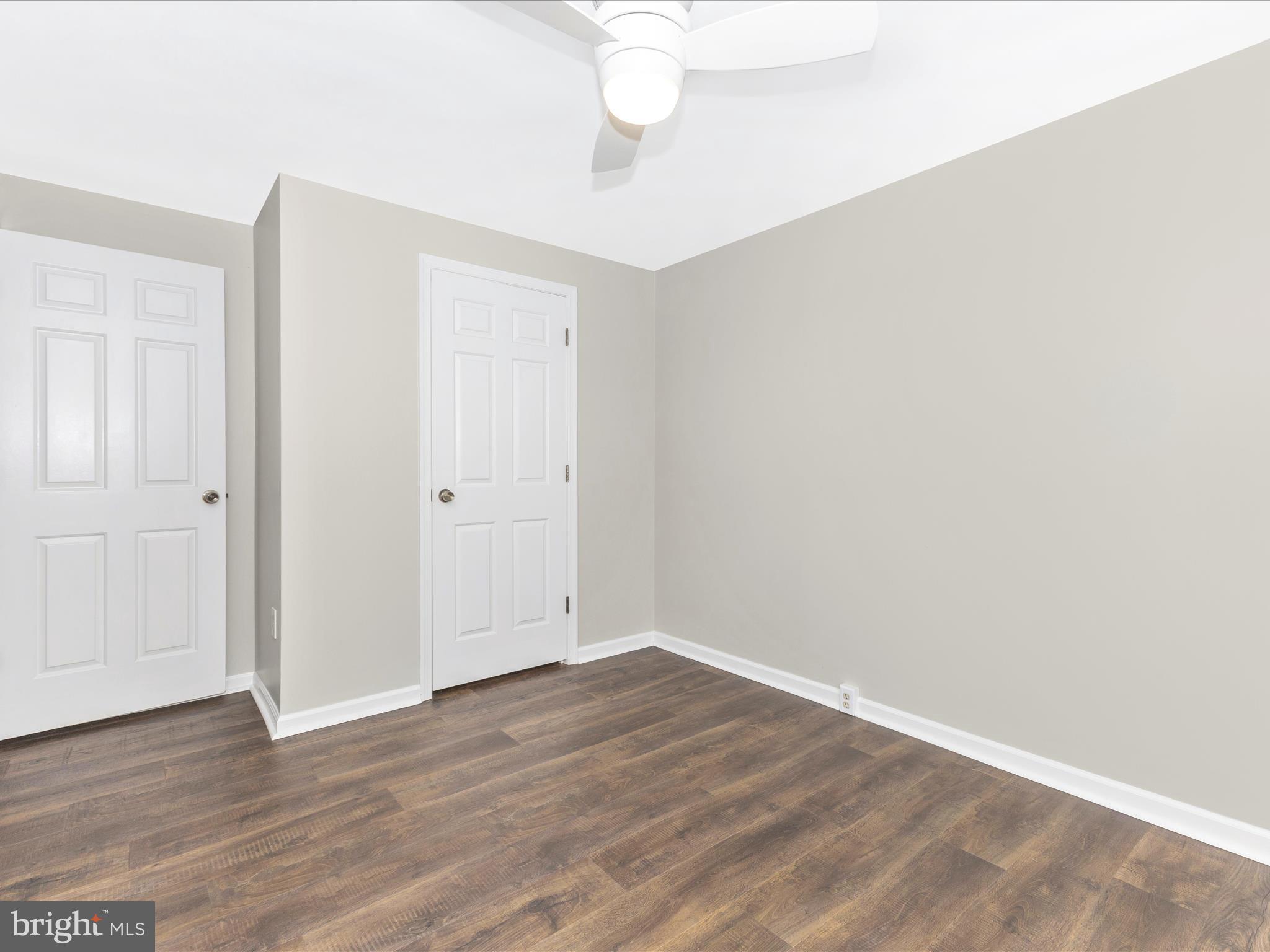 8204 Red Wing Court Frederick, MD 21701 - Photo 28 of 72 a view of an empty room with wooden floor