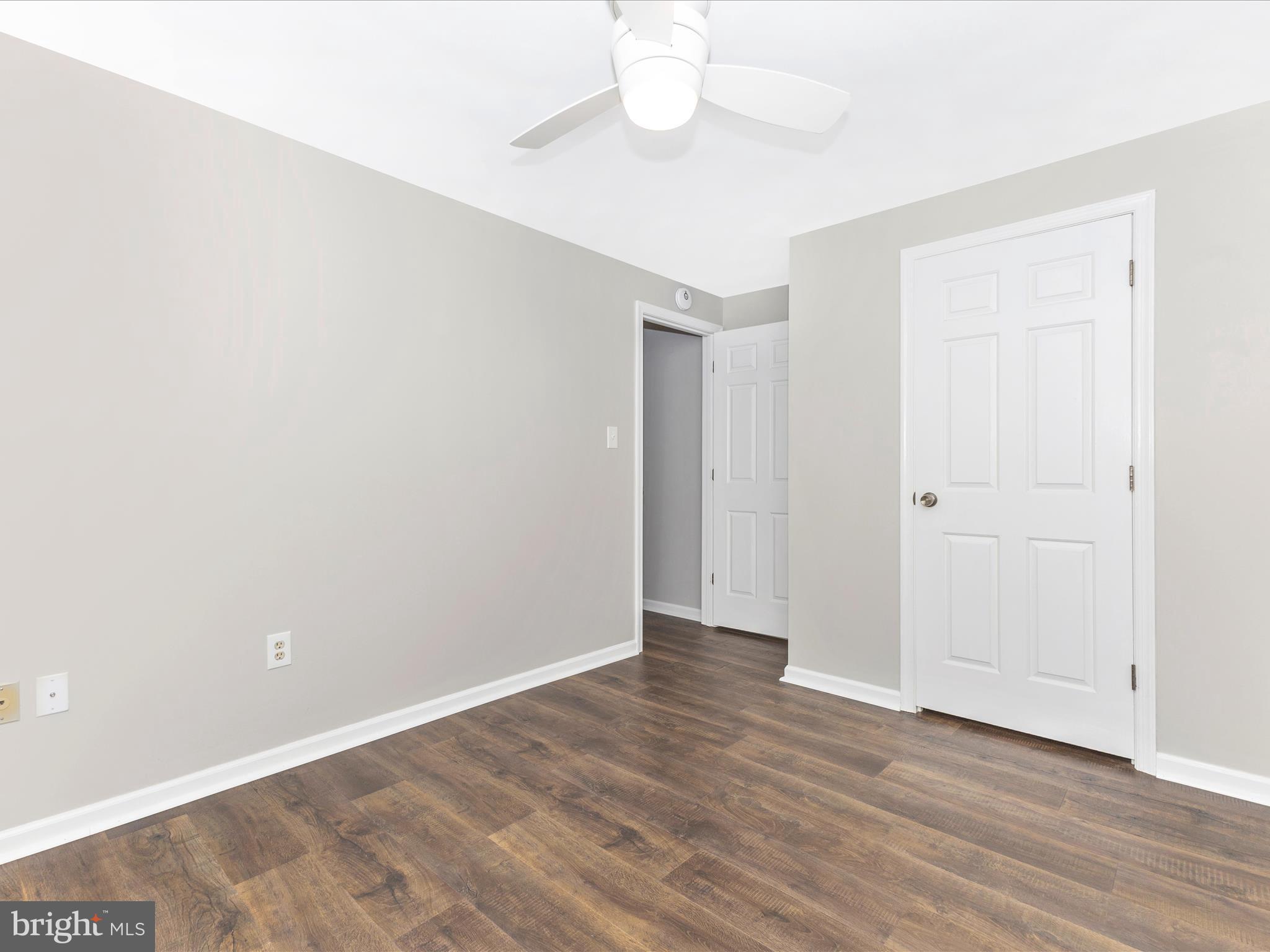 8204 Red Wing Court Frederick, MD 21701 - Photo 29 of 72 a view of an empty room with wooden floor