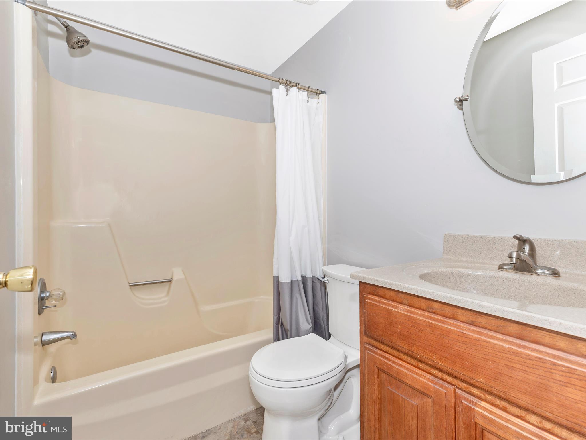 8204 Red Wing Court Frederick, MD 21701 - Photo 30 of 72 a bathroom with a granite countertop sink toilet and shower