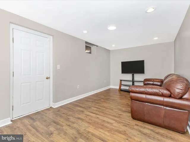 a view of a chair and table in the backyard
