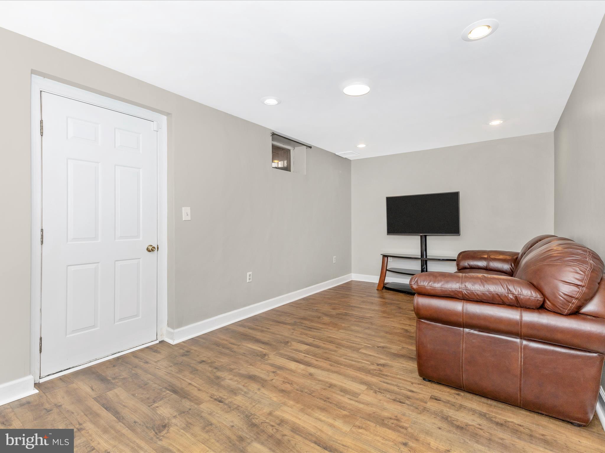 8204 Red Wing Court Frederick, MD 21701 - Photo 31 of 72 a living room with furniture and a flat screen tv