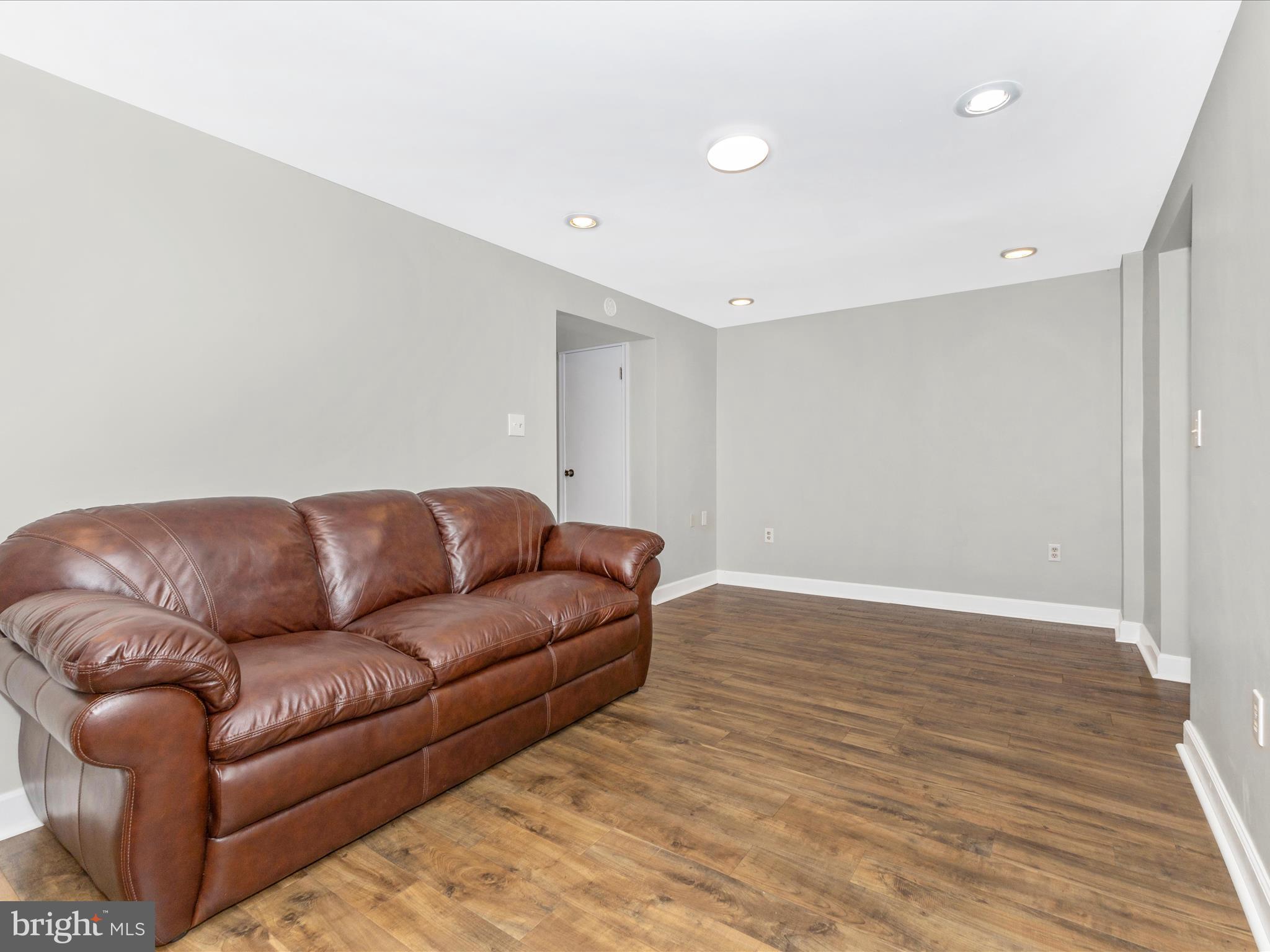 8204 Red Wing Court Frederick, MD 21701 - Photo 33 of 72 a living room with furniture and a wooden floor