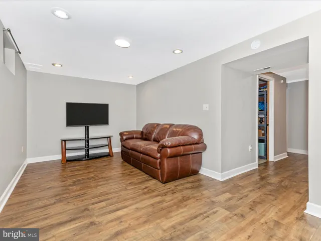 a view of a patio with a table and chairs and wooden floor