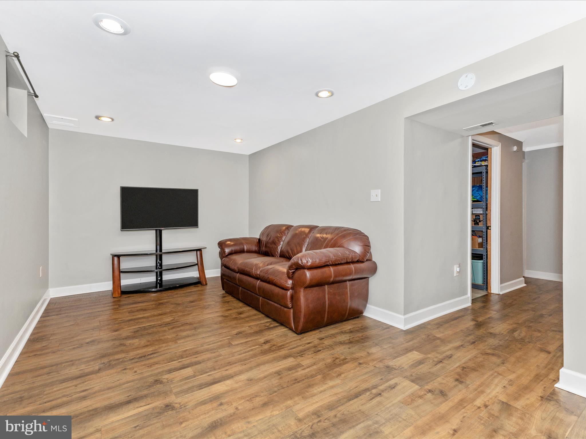 8204 Red Wing Court Frederick, MD 21701 - Photo 34 of 72 a living room with furniture and a flat screen tv