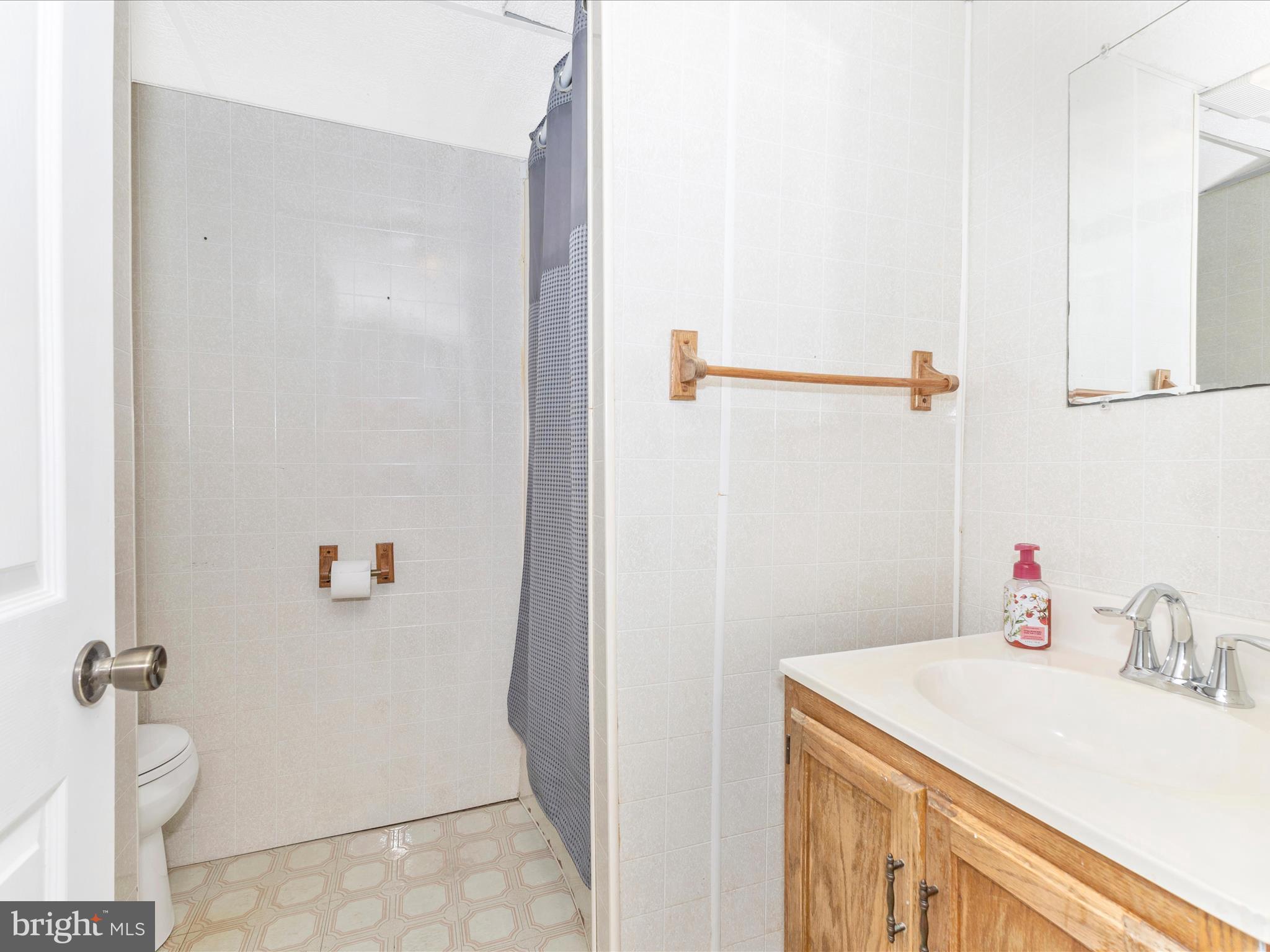 8204 Red Wing Court Frederick, MD 21701 - Photo 37 of 72 a bathroom with a sink and vanity