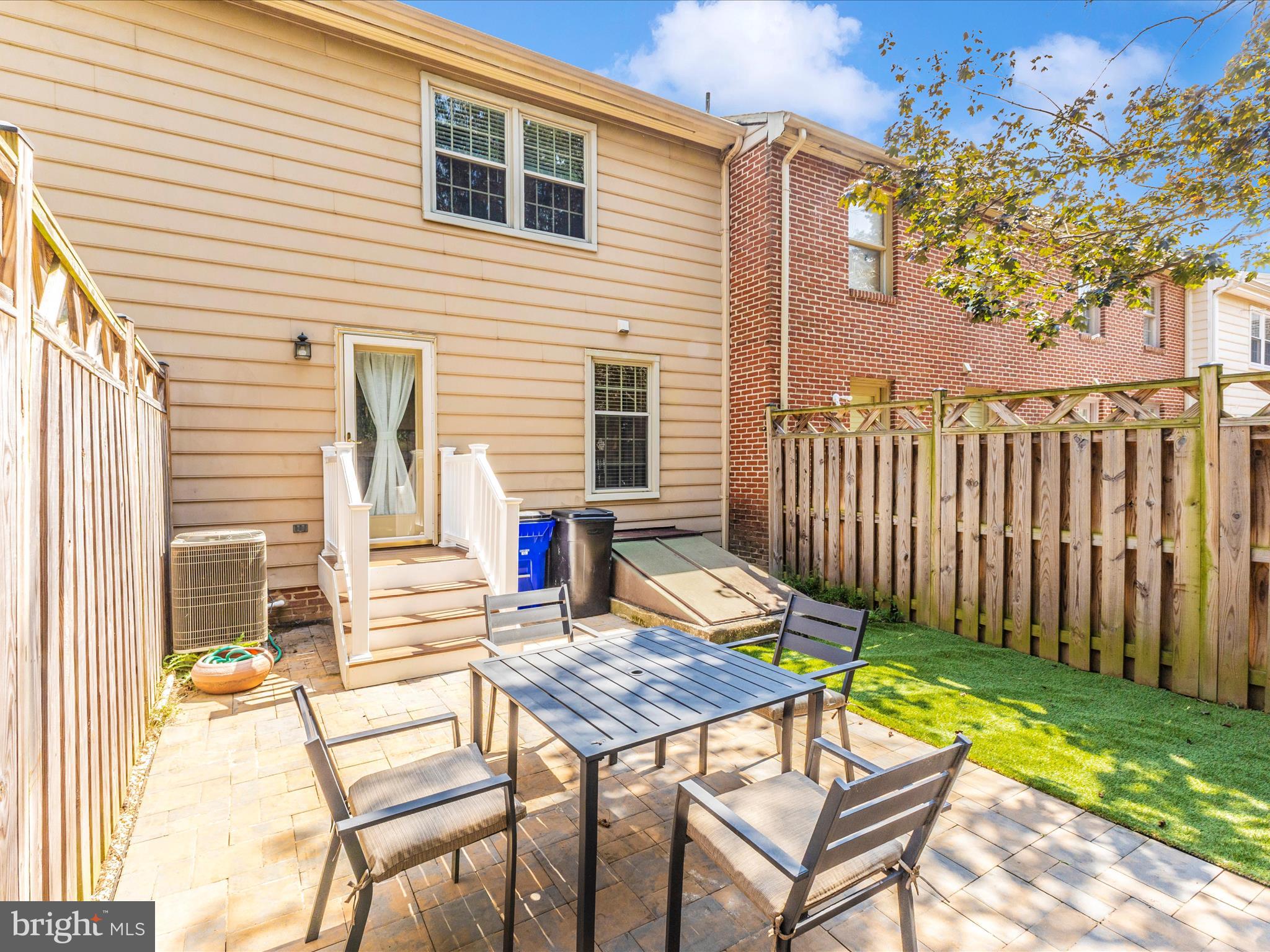 8204 Red Wing Court Frederick, MD 21701 - Photo 39 of 72 a backyard of a house with table and chairs