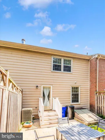 a view of a house with swimming pool and sitting area