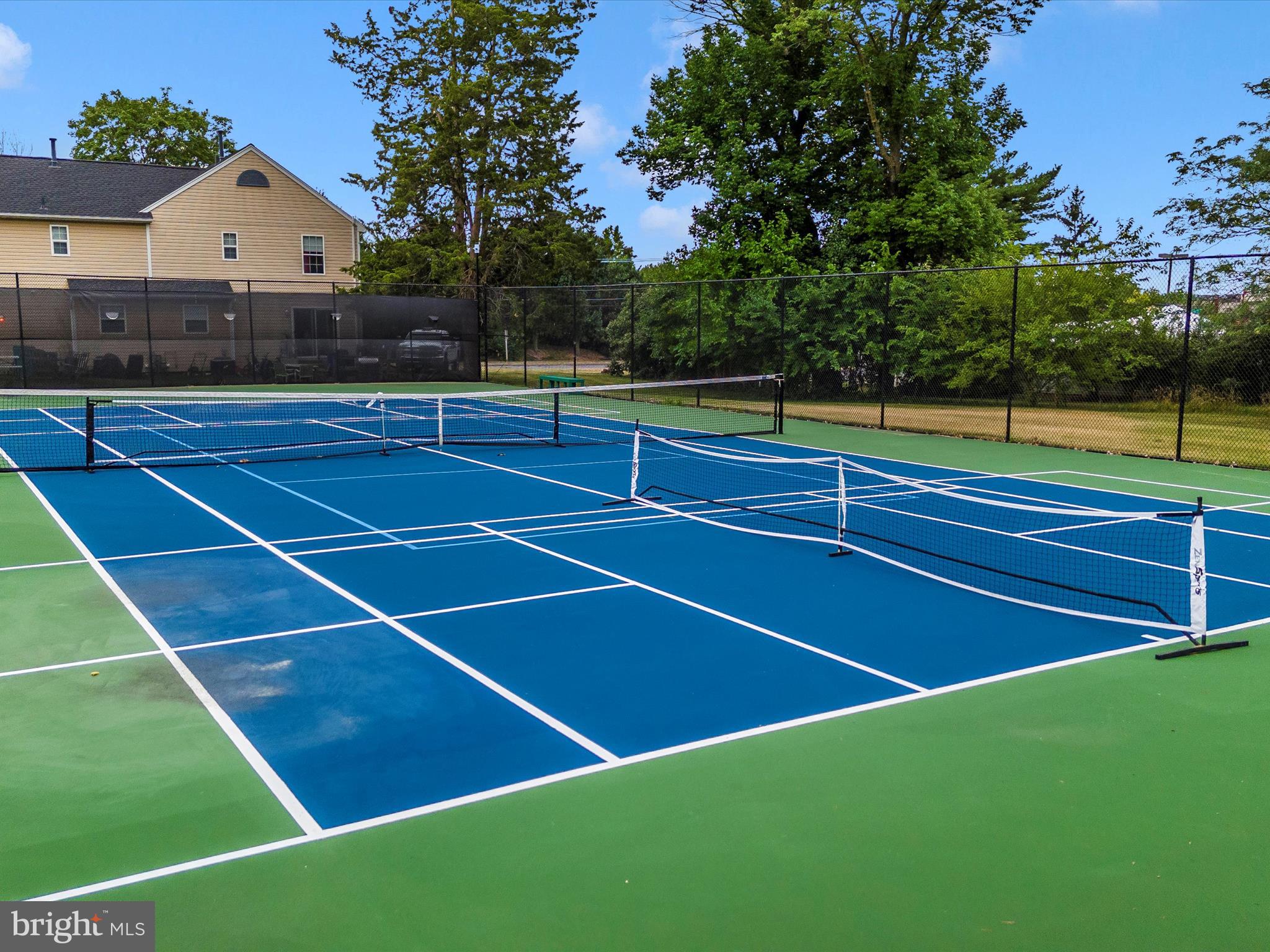 8204 Red Wing Court Frederick, MD 21701 - Photo 57 of 72 a view of tennis court with lots of trees